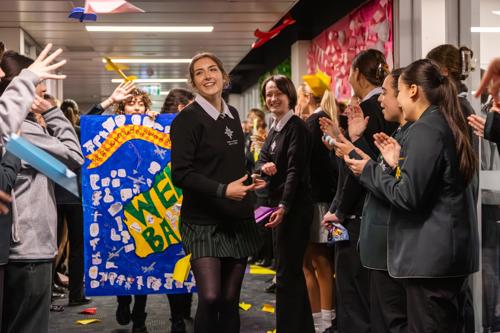 Rose Donald is celebrated by her peers at school.