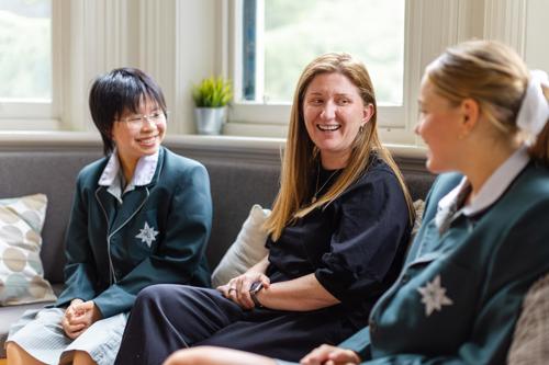 Alana Murdoch in the Boarding House with two students